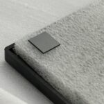 A close-up of a high-purity boron-containing diamond substrate (BDD) single-wafer, showcasing its excellent surface flatness and precise edge cutting, suitable for thermal management of high-power semiconductor devices.